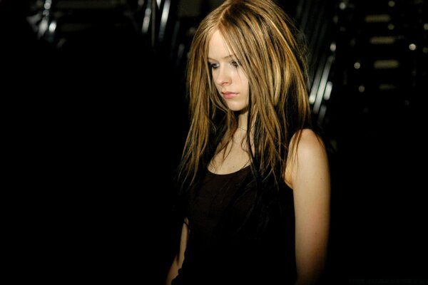 Avril Lavigne looks down