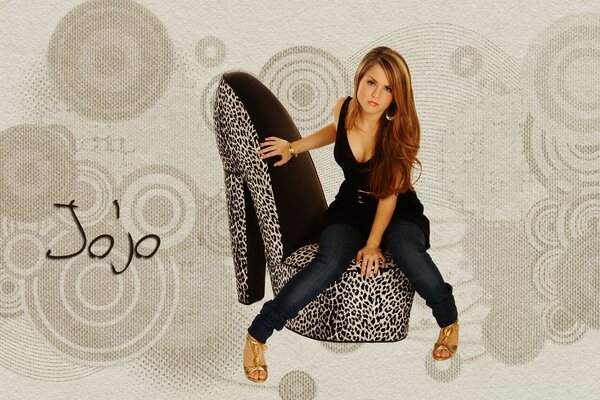 Singer on a leopard chair in the form of a shoe