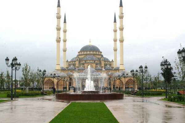 Minaret front view. Rainy weather