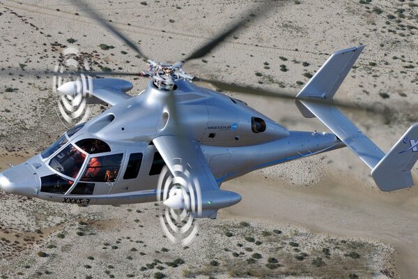 Silver helicopter with working propellers