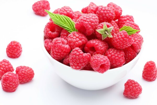 Ripe sweet raspberries in a saucer