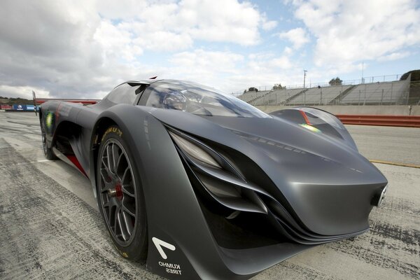 Matte black sports car on the track. Disks. Wheels