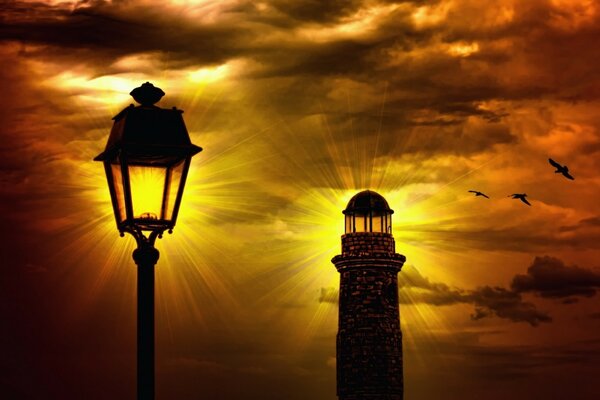 Lighthouse in the rays of the night sunset