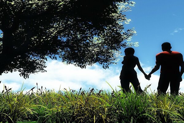 Les amoureux se tiennent la main sous un arbre