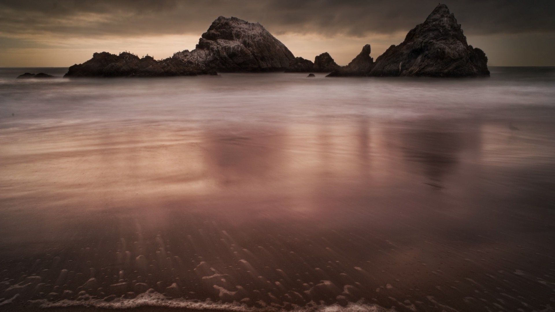 rocks boulders and stones sunset water beach sea ocean dawn evening landscape reflection seascape seashore dusk sky travel lake sun storm island rock