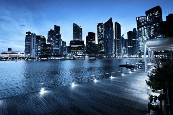 Evening landscape of city skyscrapers on the background of the sea