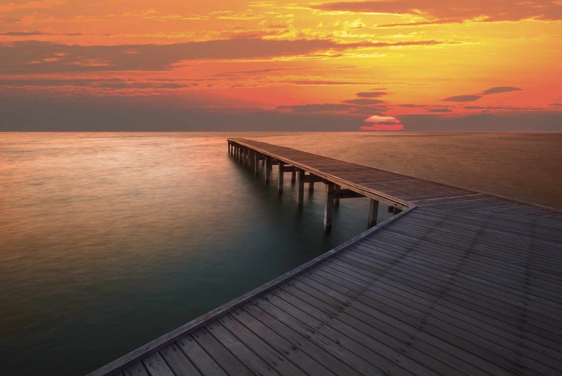 sonnenuntergang und dämmerung sonnenuntergang meer wasser ozean strand dämmerung landschaft himmel landschaft pier dämmerung meer sonne brücke see reisen abend reflexion promenade