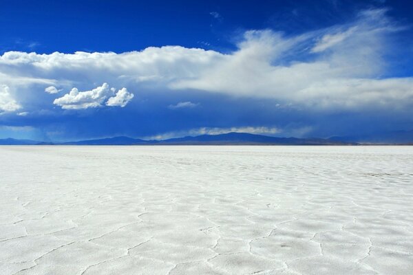 Snow-white sand under a blue sky