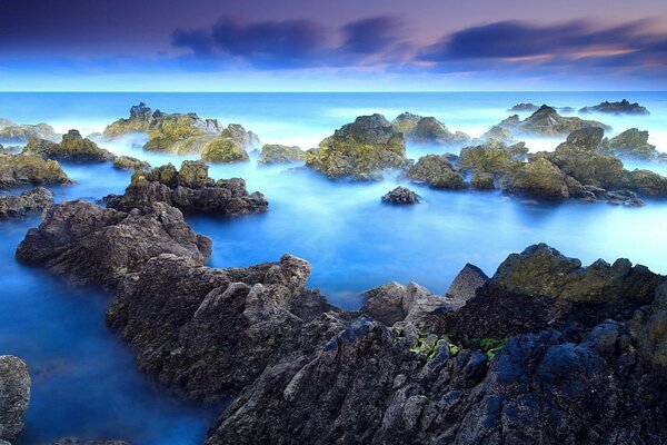 Magnificent sunset on flooded rocks