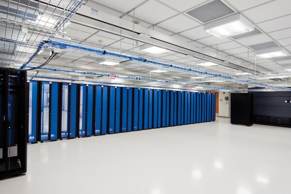 Light server room with black and blue cabinets