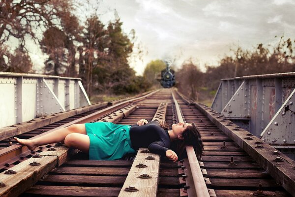 Train. The girl lying on the rails