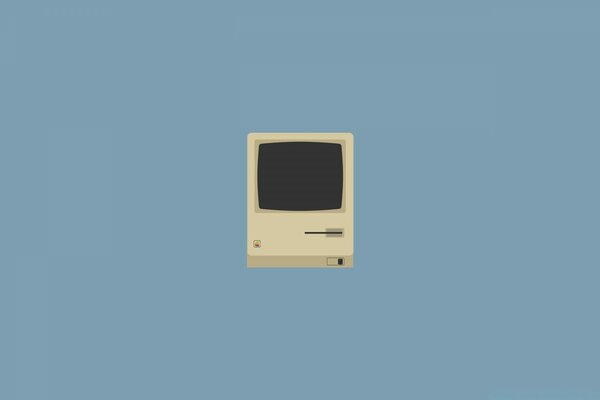 An old computer on a plain background