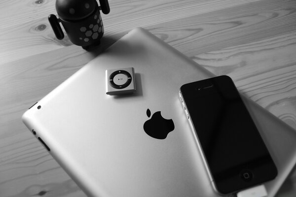 Black and white photo of laptop and phone