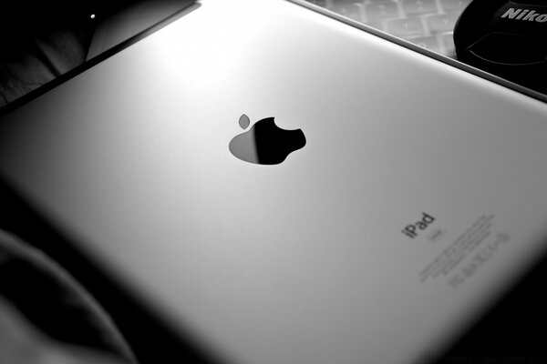 Tablet grey iPad with apple logo