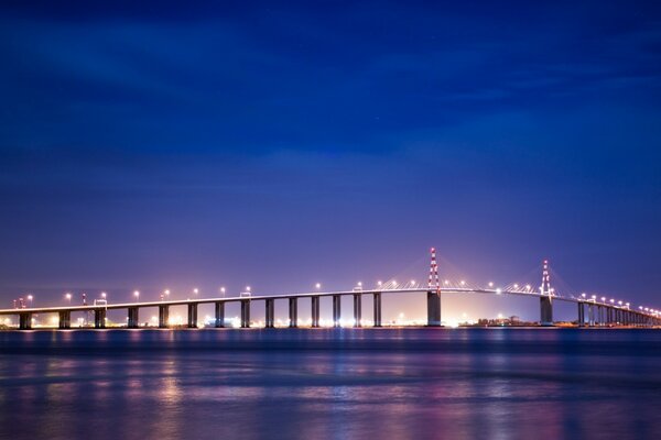 Beautiful bridge over the water at night