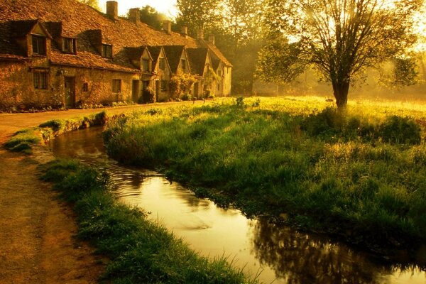 An abandoned estate next to a pond