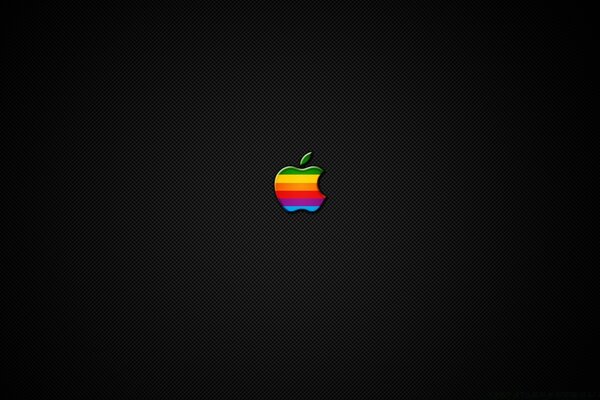 Multicolored apple on a dark background