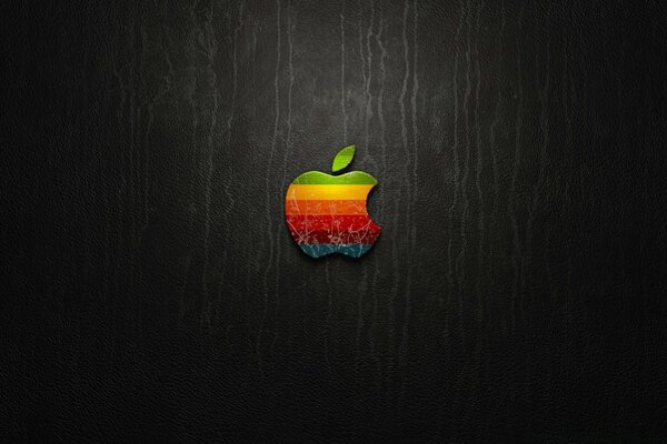 Multicolored apple on a black background