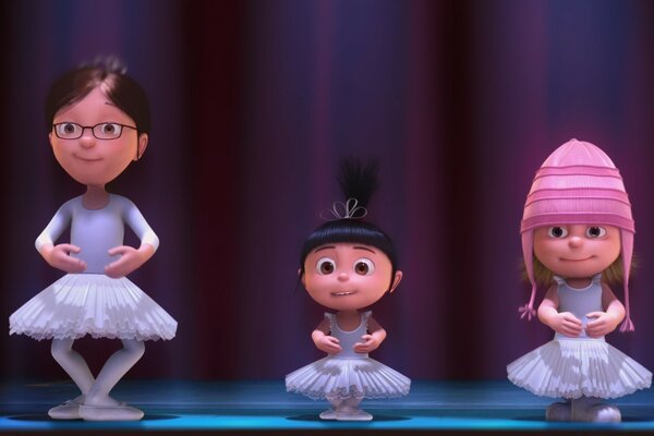 Little ballerinas in white tutus on stage