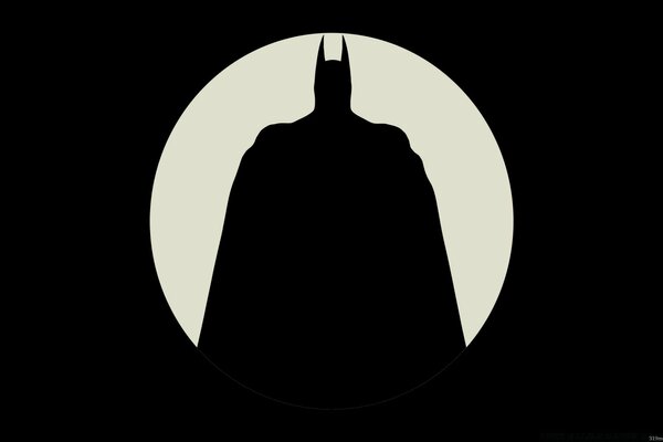 Silhouette of Superman on the background of the moon