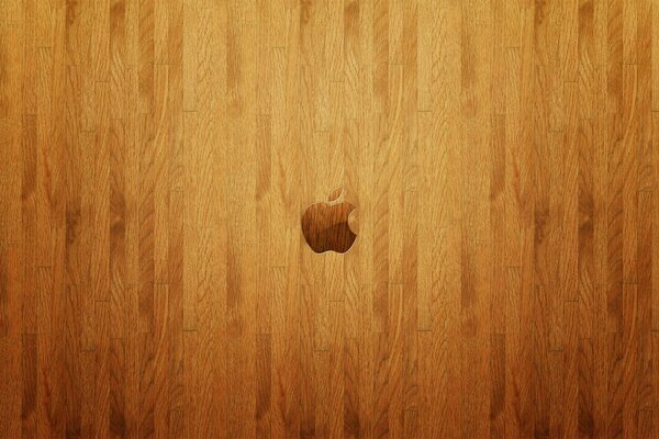 Logo Apple sur plancher en bois