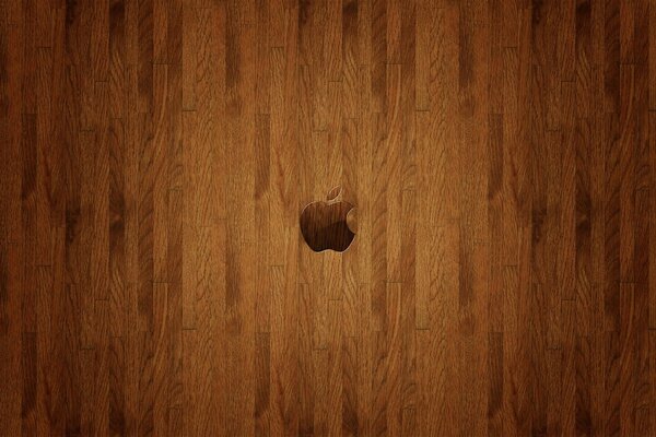 A woody background with an apple on it