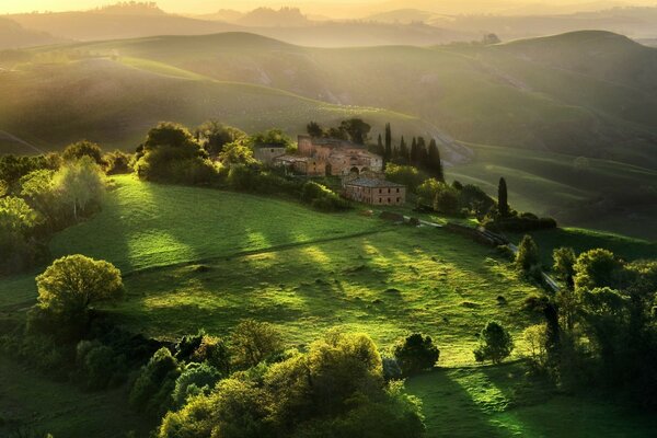 View of the green meadow and the mansion