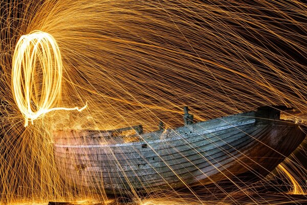 Light circle and glare over the old boat