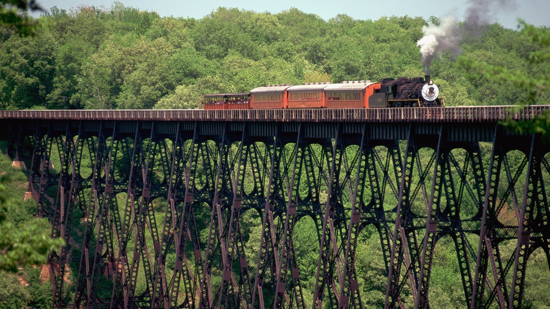 creative railway train outdoors travel wood bridge track transportation system daylight landscape water tree nature agriculture industry