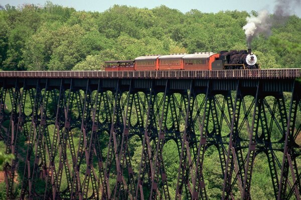 The train is traveling over a very high bridge