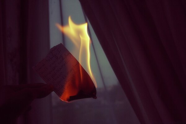 Burning fire on the background of a curtain, blurred art