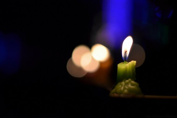 Green short candle with light highlights