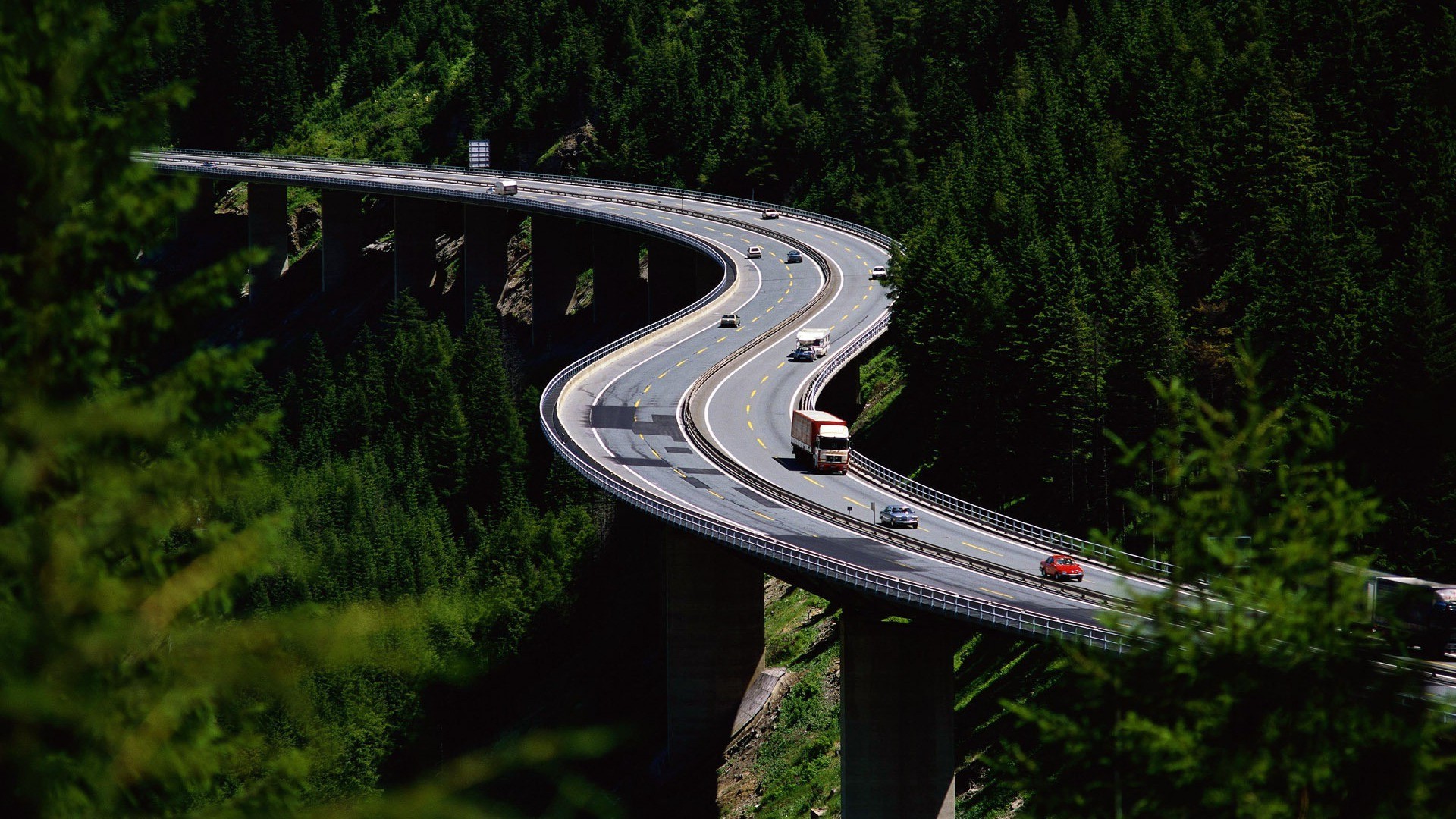 city and architecture road outdoors transportation system travel wood tree guidance grass daylight nature vehicle summer highway car landscape bridge