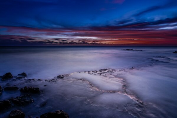 SUNSET OR SUNRISE OVER A SEA OF FOG