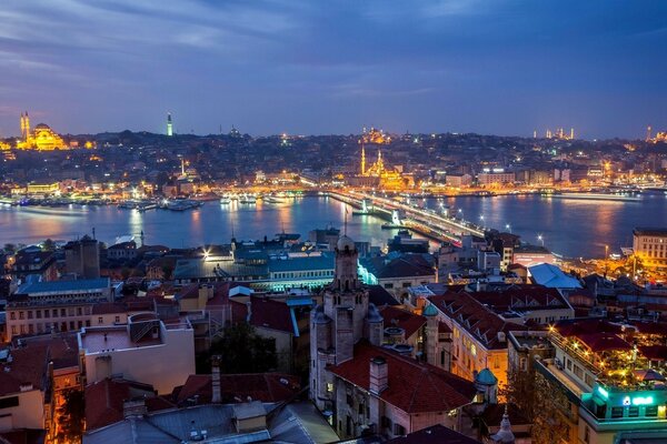 City by the water, evening and lights