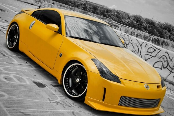 Yellow sports car on graffiti background