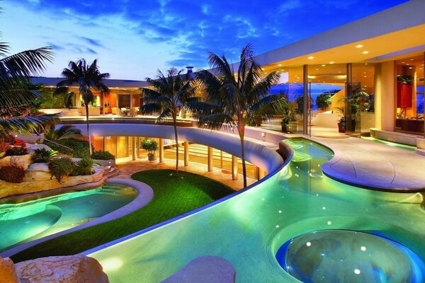 Evening view of the pools in an expensive hotel