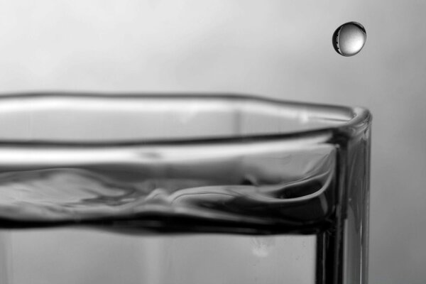 A drop of water in the reflection in the room