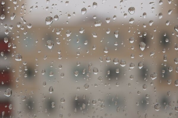 Photo of a window with raindrops on the glass