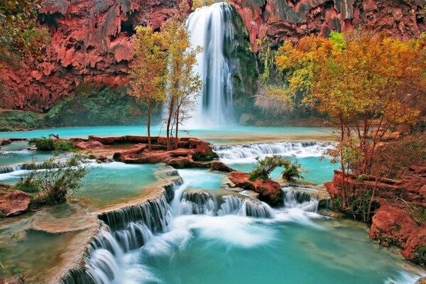 Colorful landscape of autumn waterfall