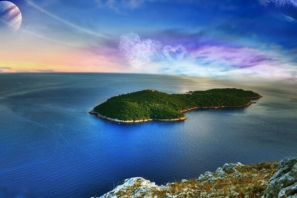 An island in the middle of the ocean and clouds in the form of a heart