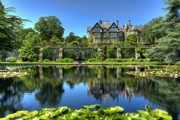 Old castle in a garden with a lake