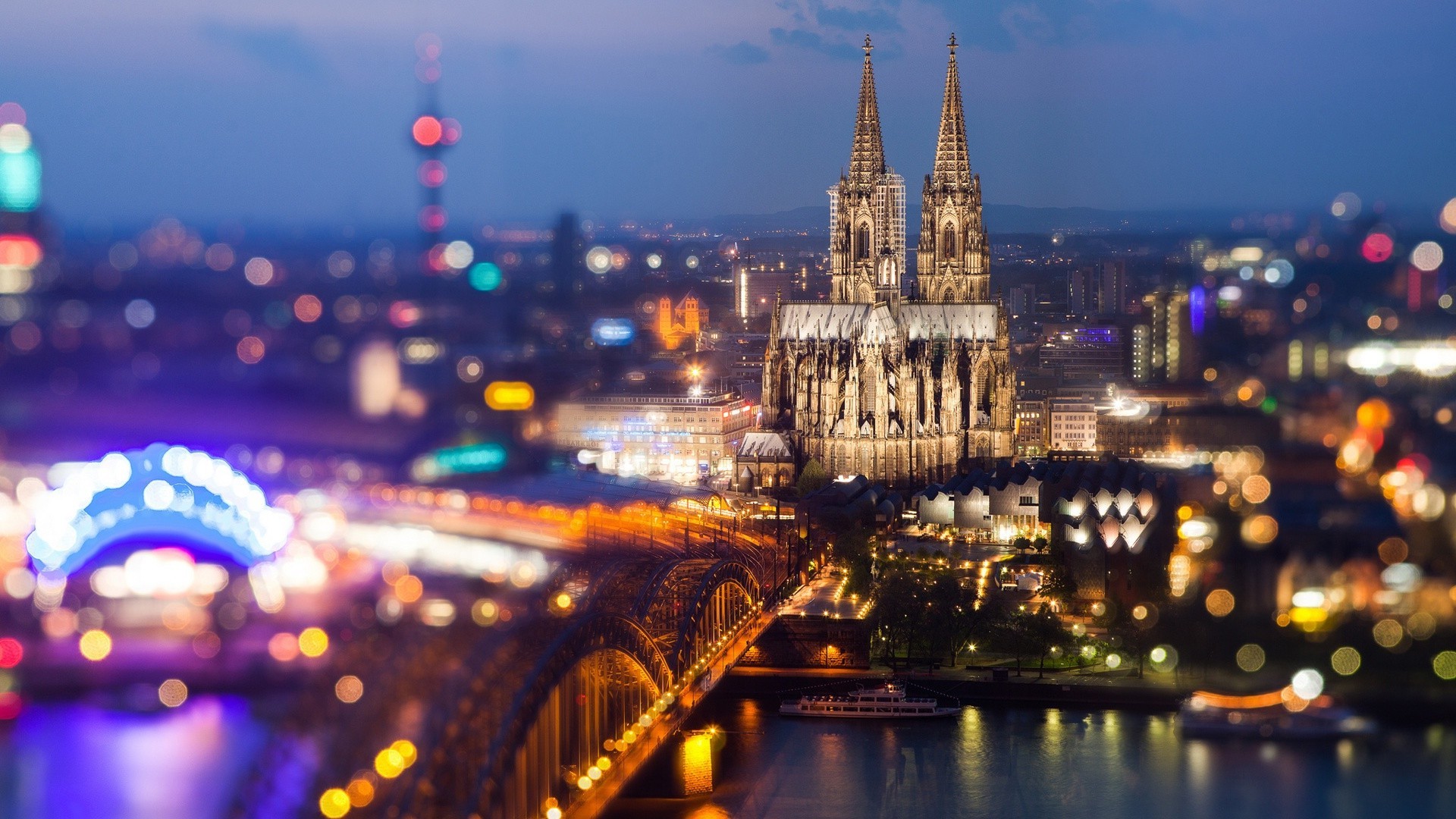 city travel dusk evening architecture illuminated bridge river sunset water outdoors cathedral building reflection urban cityscape sky light church