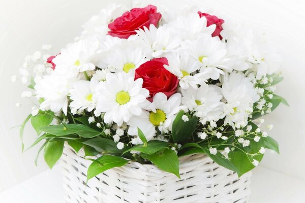 Cute bouquet of flowers in a white basket