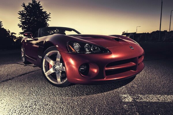 Red sports car on the road