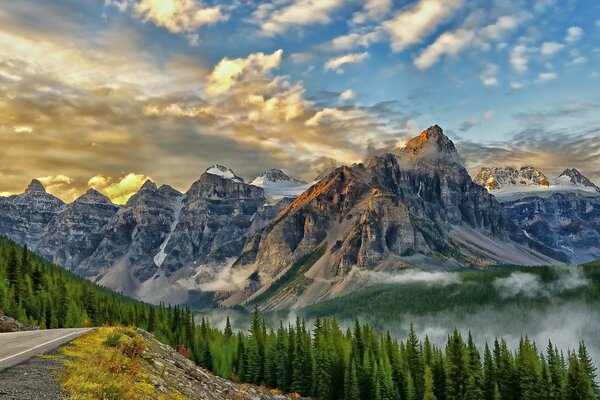 High mountains and forest below at dawn