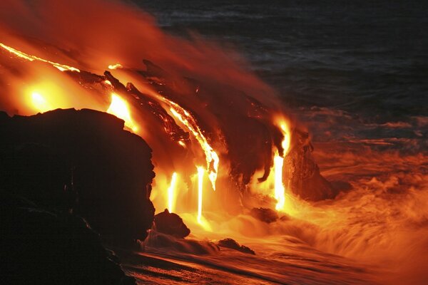 The lava of the volcano pours directly into the ocean