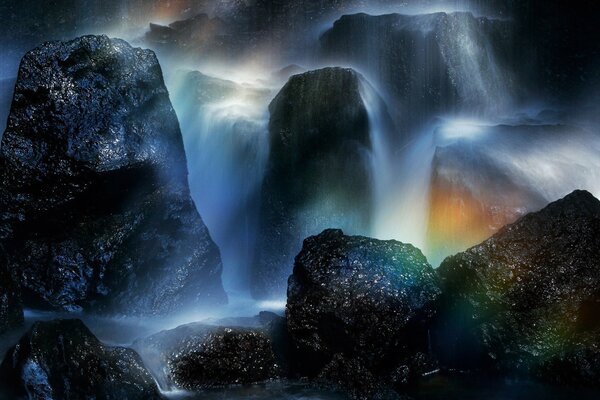 Evening waterfall with a beautiful rainbow