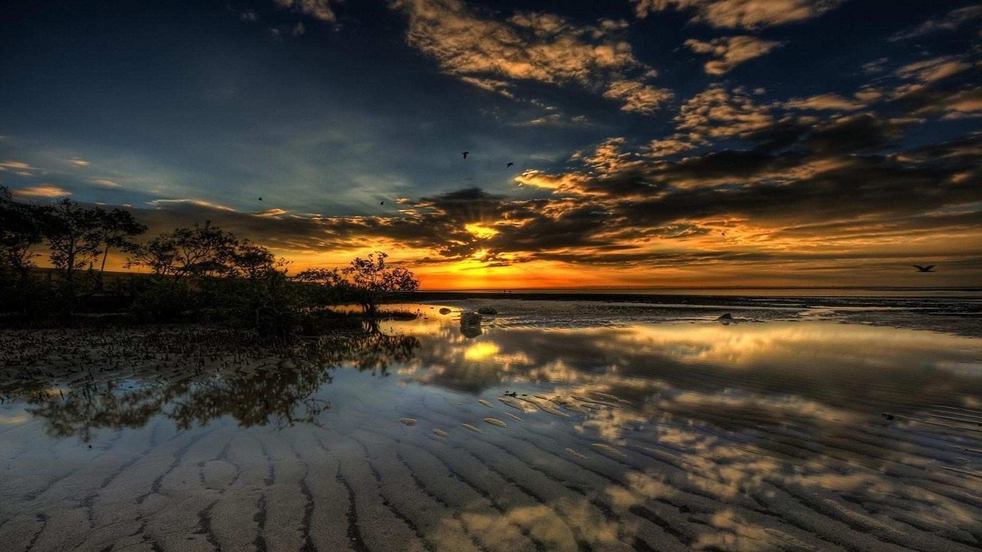 coucher de soleil et aube coucher de soleil eau aube plage crépuscule soir ciel paysage soleil nature océan mer sable voyage réflexion paysage