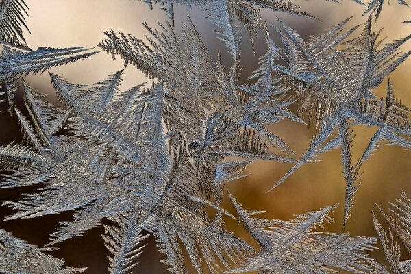 Christmas patterns on the window made of ice